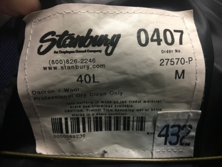 This is a set of 75 gently used navy blue Stanbury marching band jackets with navy and whi