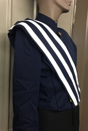 This is a set of 75 gently used navy blue Stanbury marching band jackets with navy and whi