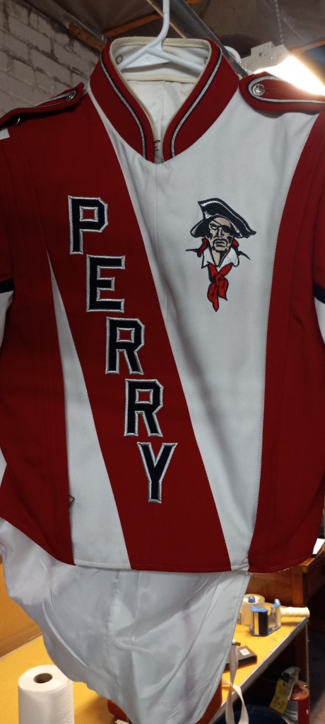 This is a lot of 138+/- red, white and black marching band jackets.