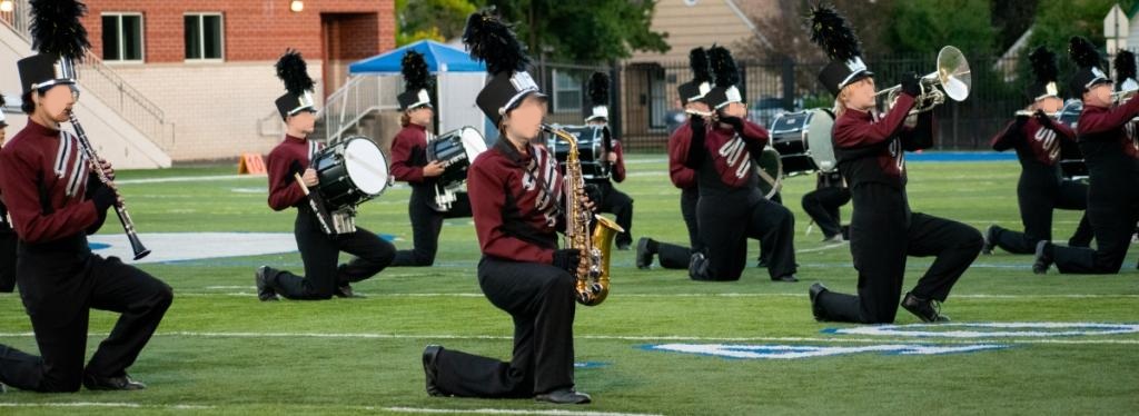Set of 90+ Burgundy, Black, and Silver Marching Band Uniforms