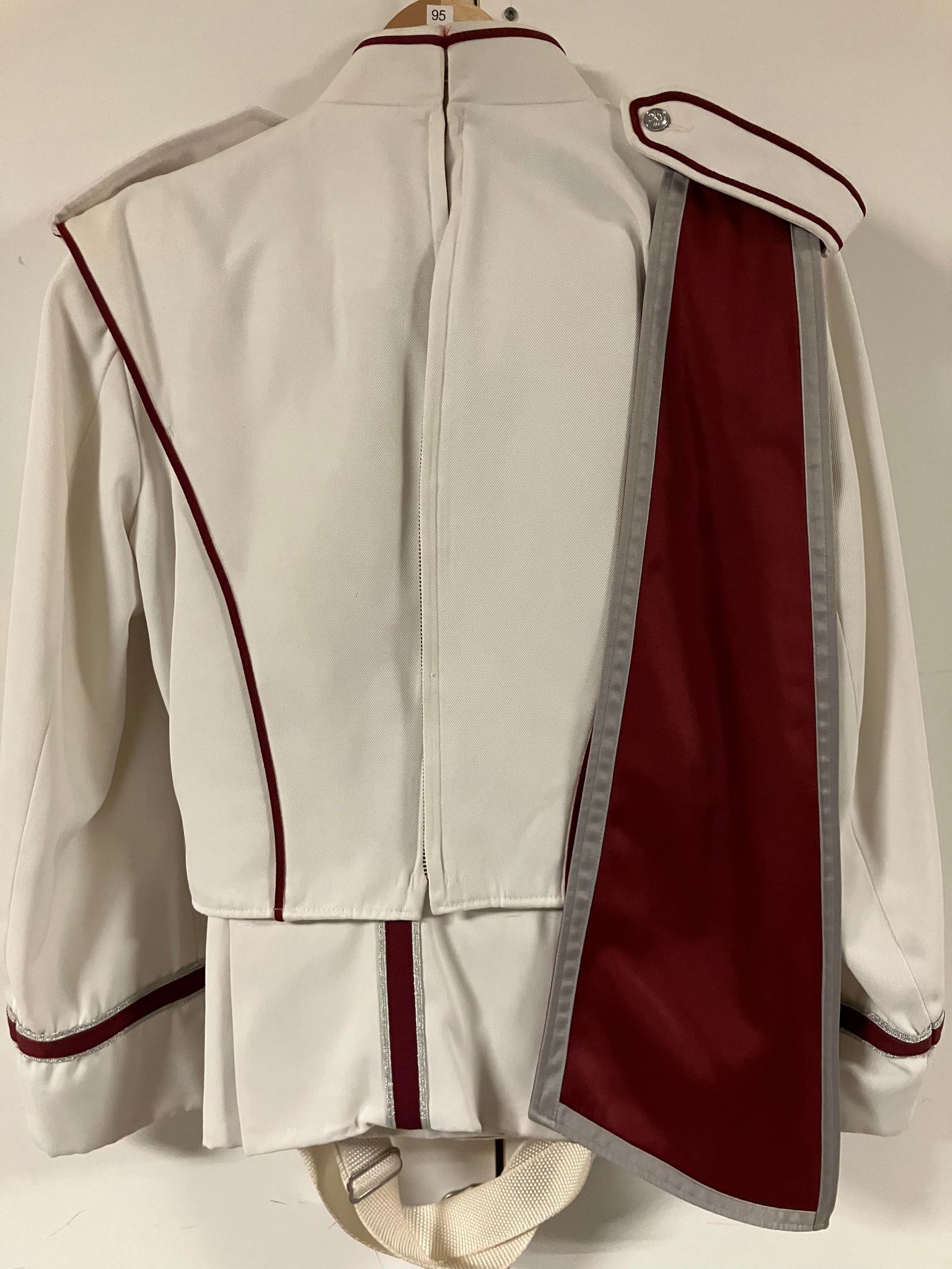 114 complete sets of White with Maroon used marching band uniforms