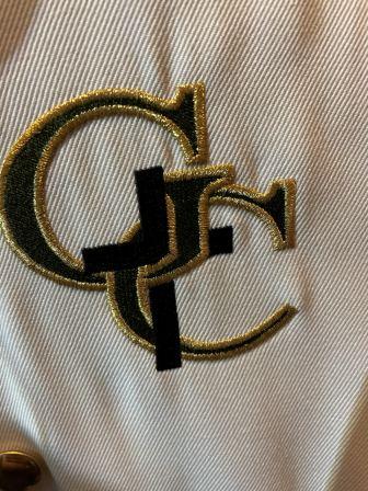 Set of 68 Green, Gold, and White Marching Band Uniforms and 43 Gold Helmets