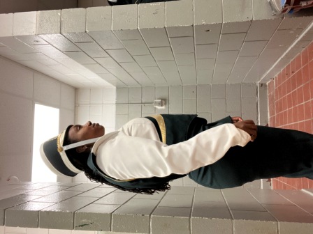 Set of 100 green, white, and gold Furhman marching band uniforms with matching shakos. Must be purch